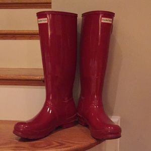 Shiny red tall Hunter boots